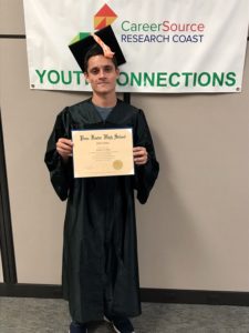 Matthew with his diploma