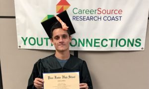 Matthew with his diploma