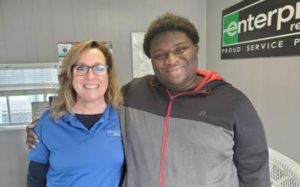 Eckerd Connects Workforce participant, Dante, with business owner, Julie Walker; starting his first day of a paid internship with DJ’s Collision.
